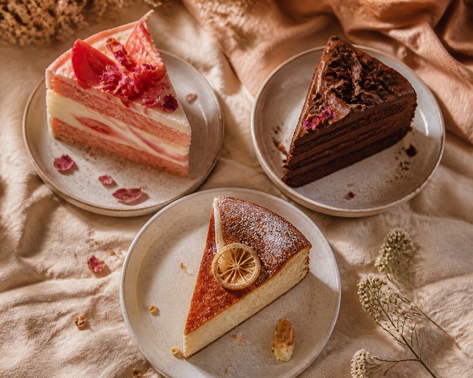 Three cake slices arranged on warm linen